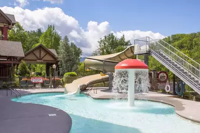 outdoor pool and water slide at the appy