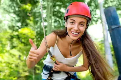 A young woman at a zipline course.