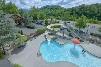 outdoor pool with mushroom and slide